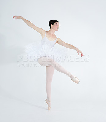 Buy stock photo Dance, ballet and elegant with woman in studio for balance, creative and performance. Artist, theatre and training with ballerina dancing ion white background for competition, freedom and commitment