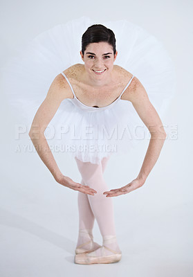 Buy stock photo Portrait, dance and ballet with a woman in studio on a white background for rehearsal or recital for theatre performance. Art, creative and smile with a happy young ballerina or dancer in uniform