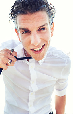 Buy stock photo Male person, portrait and loose tie fun for cool confidence, carefree personality or stylish trend. Man, face and smile for edgy attitude outside in suit clothes, white background closeup or wet hair