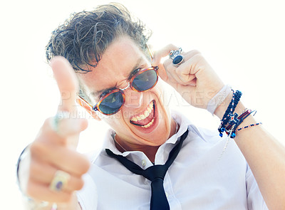 Buy stock photo Man, gun finger and portrait with sunglasses, crazy and sign language for punk attitude by white background. Rock person, shouting and shooting with vintage jewelry, edgy clothes and point at you