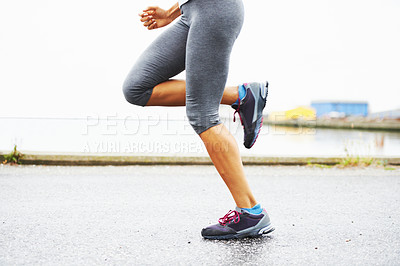 Buy stock photo Cropped view of a woman's legs while out for a jog