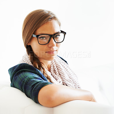 Buy stock photo Portrait, face and woman in glasses on sofa for fashion in living room of home, house or apartment. Young, eyewear and girl in lounge to relax on couch in style, cool clothes or scarf in Switzerland