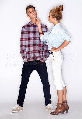 Buy stock photo Portrait, fashion couple and partner pointing in studio isolated on white background. Confident man, serious woman and gesture for cool style, trendy clothes and love or care in relationship together