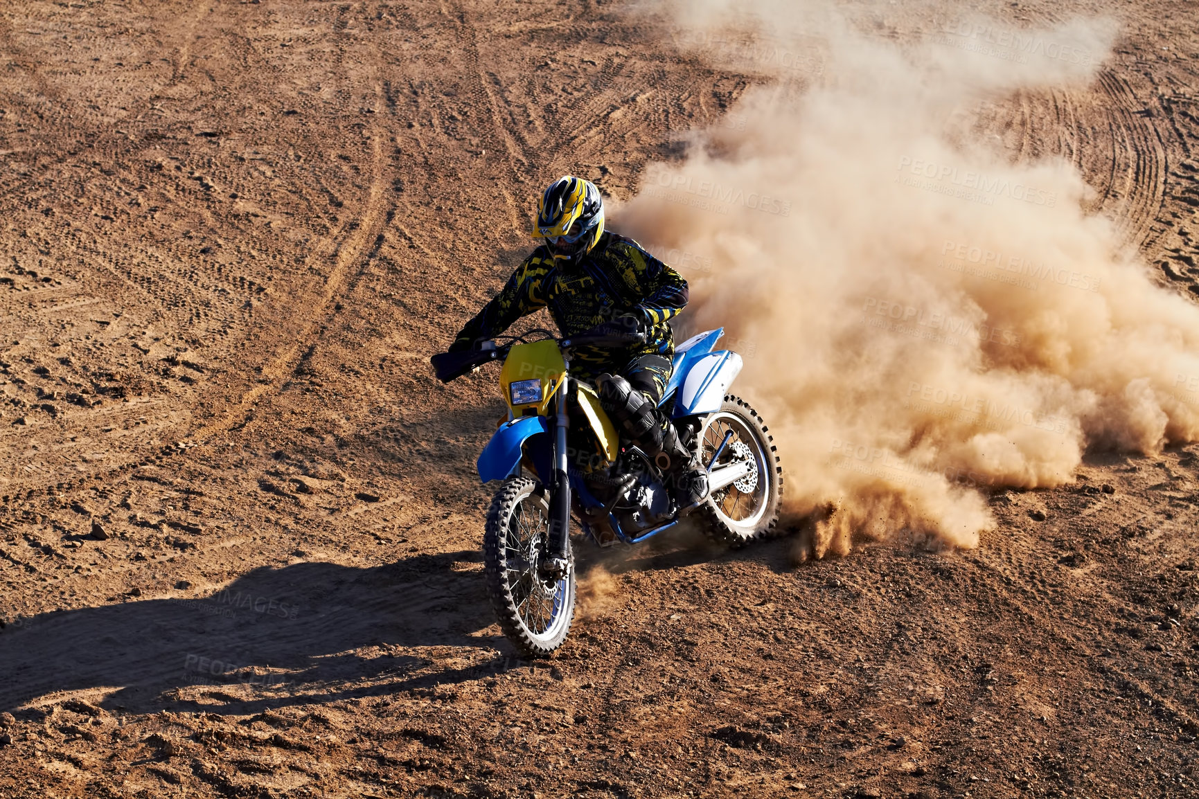 Buy stock photo Man, motorcycle and bike dust cloud as professional rider in action danger competition, fearless or race. Male person, transportation or fast speed dirt adventure or rally, challenge gear or driving