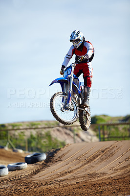 Buy stock photo Person, motorcycle or bike hill jump as professional in action danger competition, fearless or race risk. Rider, off road transportation or fast speed dirt adventure or rally, extreme sport or gear
