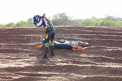 Buy stock photo Accident, sports and man biker on a dirt road for competition, race or training workout. Fitness, motorcycle and frustrated male athlete with mistake on bike in outdoor sand dunes or desert for hobby