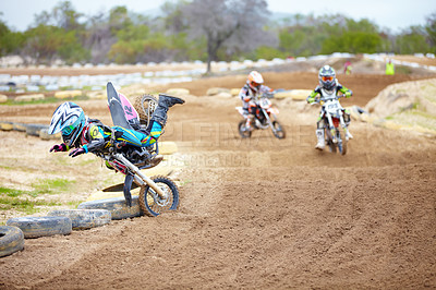 Buy stock photo Sports, accident and man biker in a race on a dirt road in the desert with competition for hobby. Fitness, training and male athlete falling off bike and driving in a sand dune for adventure workout.