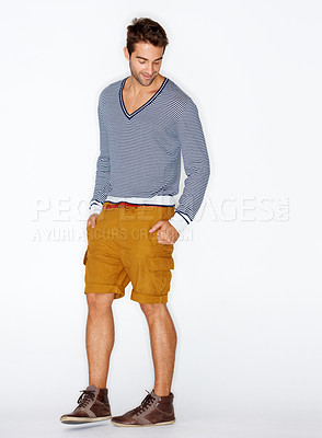 Buy stock photo Fashion, clothes and casual with a man in studio on a white background for trendy hipster style. Model, natural and cool with a confident young person in a clothing outfit to relax for comfort
