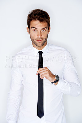 Buy stock photo Portrait, fashion and tie with a business man in a shirt in studio on a white background for corporate style. Work, employee and a confident young model in a professional clothes outfit for his job