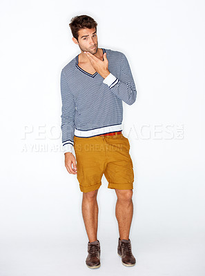 Buy stock photo Handsome, portrait and a man with fashion on a white background for style, trendy and cool. Unique, stylish and a confident guy or model with clothes, shorts or casual clothing on a studio backdrop