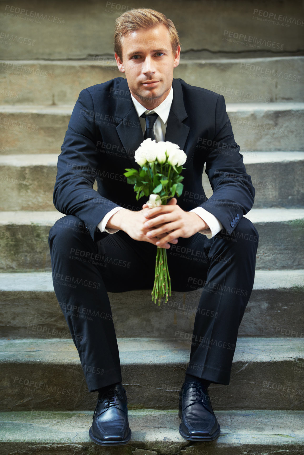 Buy stock photo Stairs, portrait and man with flowers for valentines day, romance or gesture while sitting outdoors. Roses, face and gentleman with bouquet for love, anniversary or first date, confident and handsome