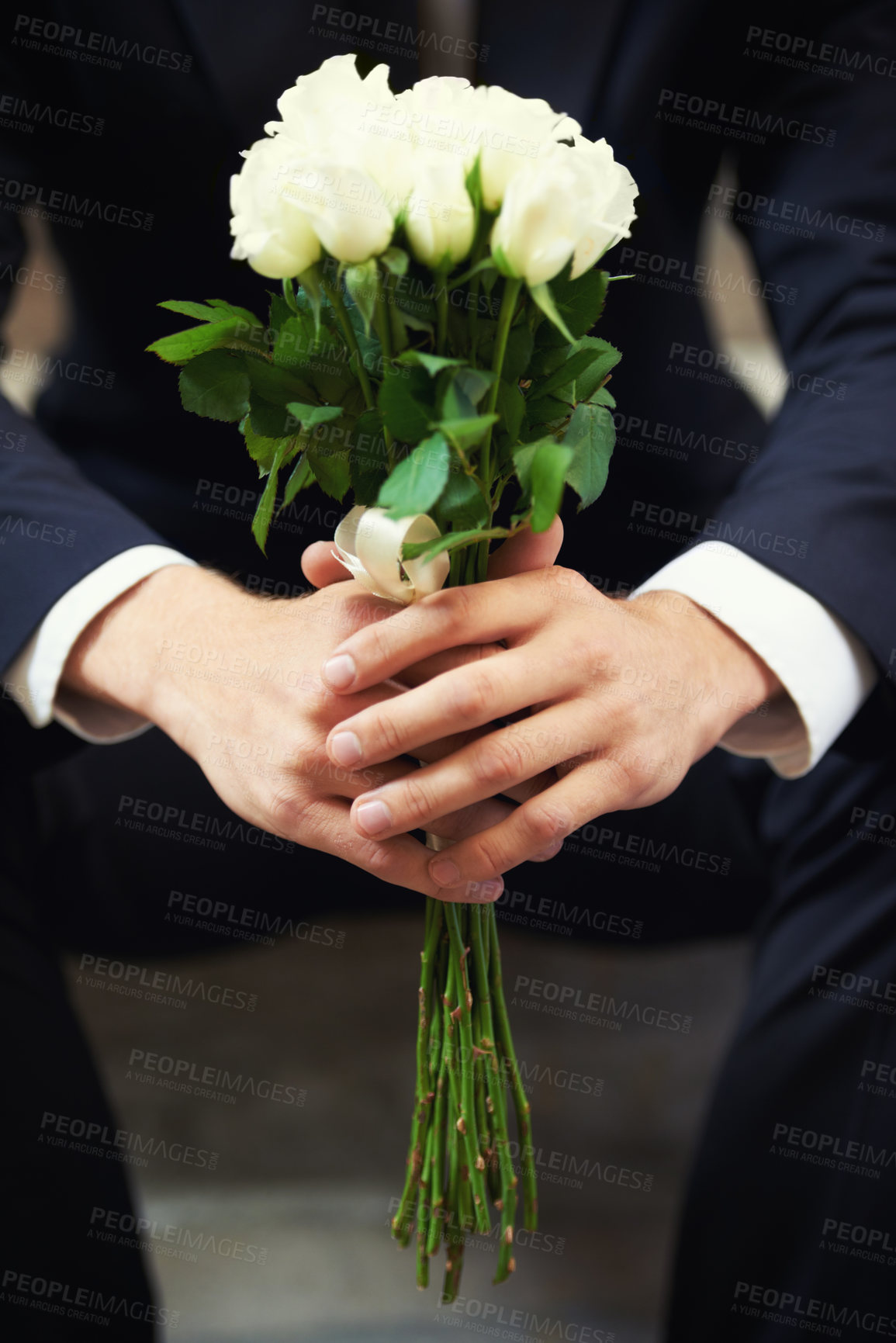 Buy stock photo Hands, flowers and man on wedding day waiting for ceremony of love, tradition or romance closeup. Floral bouquet, marriage and commitment with a groom sitting outdoor alone at a celebration event