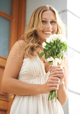 Buy stock photo Portrait, woman and white roses for celebration, outdoor and smile in city, cheerful and joyful. Face, female and lady with elegant dress, flowers or in town for achievement, wedding or gift for love