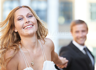 Buy stock photo Portrait, woman and man holding hands with smile in city, celebration and Valentines day with joy. Face, couple touch hand or dressed up with elegant outfit, happiness and affection outdoor with love