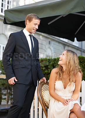 Buy stock photo Love, couple and in restaurant, celebration and relationship with romance, Valentines day date and happiness. Romantic man and woman outdoor, elegant and loving together for marriage and surprise