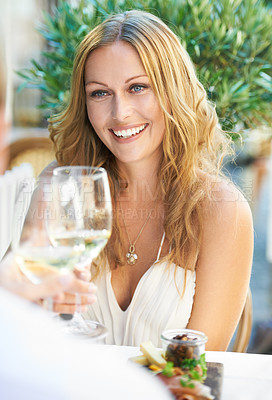 Buy stock photo Toast, woman and champagne for couple at a restaurant for valentines day, love and celebration. Wine, toasting and cheers from lady to man on first date, romance or anniversary while celebrating
