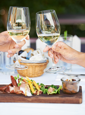 Buy stock photo Love, toast and wine with hands of couple at restaurant for food, valentines day and celebration. Champagne, fine dining and relax with man and woman cheers at table for happy, marriage and date