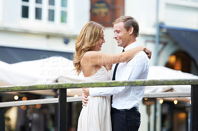 Buy stock photo Happy couple, bridge and hug outdoor with love, care and romantic valentines date with happiness together. Man, woman and intimate embrace for bonding, city adventure and funny moment for comic laugh