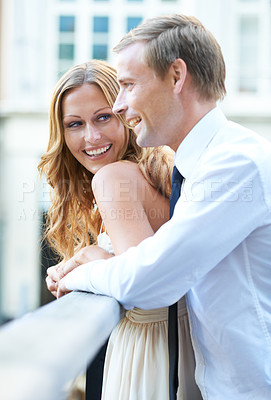 Buy stock photo Love, romance and couple on bridge for valentines day celebration happy fun in the city. Embrace, man and woman with smile standing on balcony or terrace while on romantic valentine date together.