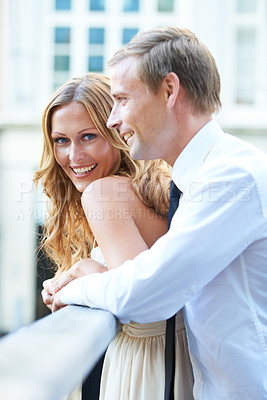 Buy stock photo Love, couple and on bridge for celebration, smile and quality time for Valentines day, romance and loving. Portrait, man and woman outdoor, happiness and affection in city, bonding together and happy