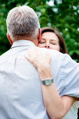 Buy stock photo Senior couple, nature and a hug for love, care and bonding together in retirement. Comfort, elderly and a man and woman with affection, romance or loyalty in a marriage in a garden or park for a date