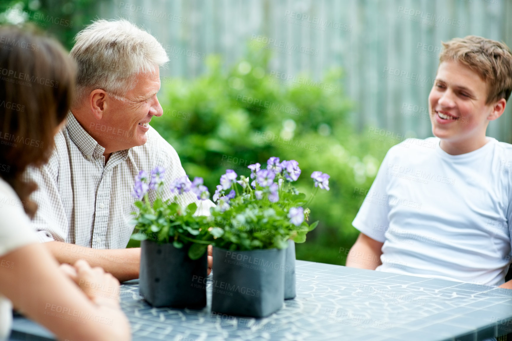 Buy stock photo Grandparents, boy and outdoor with smile, backyard and home with family, teenager and garden. Retired, man and woman with conversation, happiness and child for bonding together, support and relax