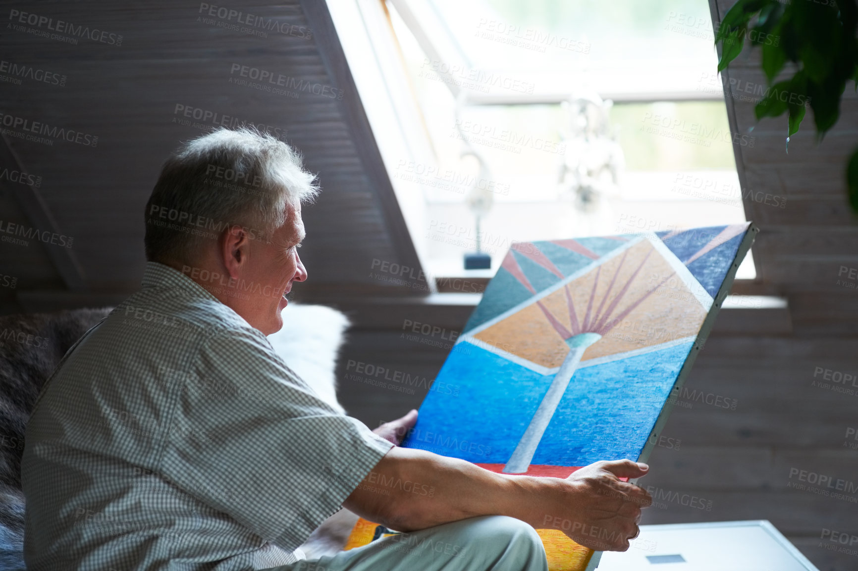 Buy stock photo Senior man, artist or holding painting with pride in home by window for creative art or expression. Picture, painter or mature person in room for watercolor drawing or design on canvas for artwork 