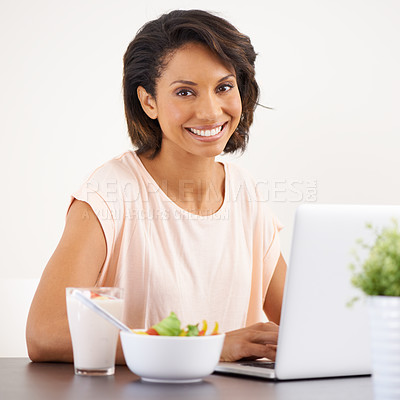 Buy stock photo Eating, salad and woman working with laptop and healthy food or nutrition in home and office. Happy, portrait and hungry for lunch with fruit and vegetables for diet, energy or wellness in house