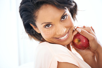 Buy stock photo Health, apple and portrait of woman in a studio for wellness, nutrition and organic diet. Smile, vitamins and happy young female person eating a fruit for healthy vegan snack by white background.