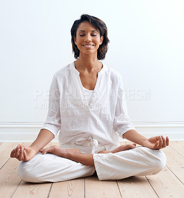 Buy stock photo Woman, smile and meditate in lotus position at home, relax and peace or zen for mental health. Happy indian female person, yoga and tranquil for aura, chakra and health, harmony and serenity on floor