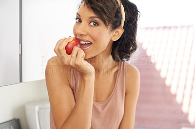 Buy stock photo Health, apple and portrait of woman in a studio for wellness, nutrition and organic weight loss diet. Smile, vitamins and female person from Mexico eating a fruit for healthy vegan snack at home.