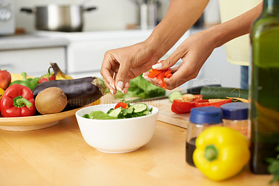Buy stock photo Hands, cooking and salad with a person in the kitchen of a home closeup for health, diet or nutrition. Food, bowl and ingredients for a vegetarian meal with an adult in an apartment for dinner