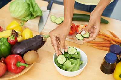 Buy stock photo Hands, salad and a person cooking from above in the kitchen of a home for health, diet or nutrition. Food, recipe and ingredients in a bowl with an adult in an apartment for a vegetarian meal closeup