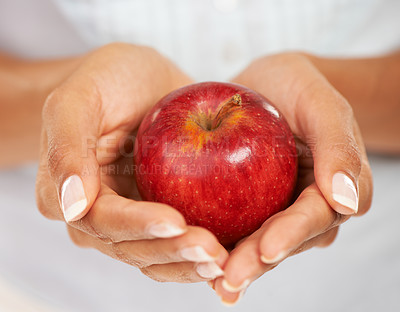 Buy stock photo Closeup, hands and woman with a red apple, nutrition and healthy snack with diet plan. Person, home and girl with a fruit, treat and wellness with fresh produce, nature and balance with vitamin c