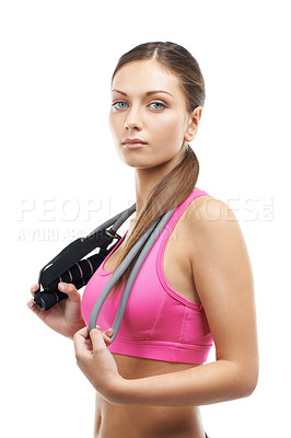 Buy stock photo Fitness, skipping rope and portrait of woman on a white background for workout, exercise and training. Serious, performance and person with gym equipment for sports, wellness and health in studio