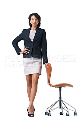Buy stock photo Studio portrait of a successful businesswoman sitting on a chair against a white background