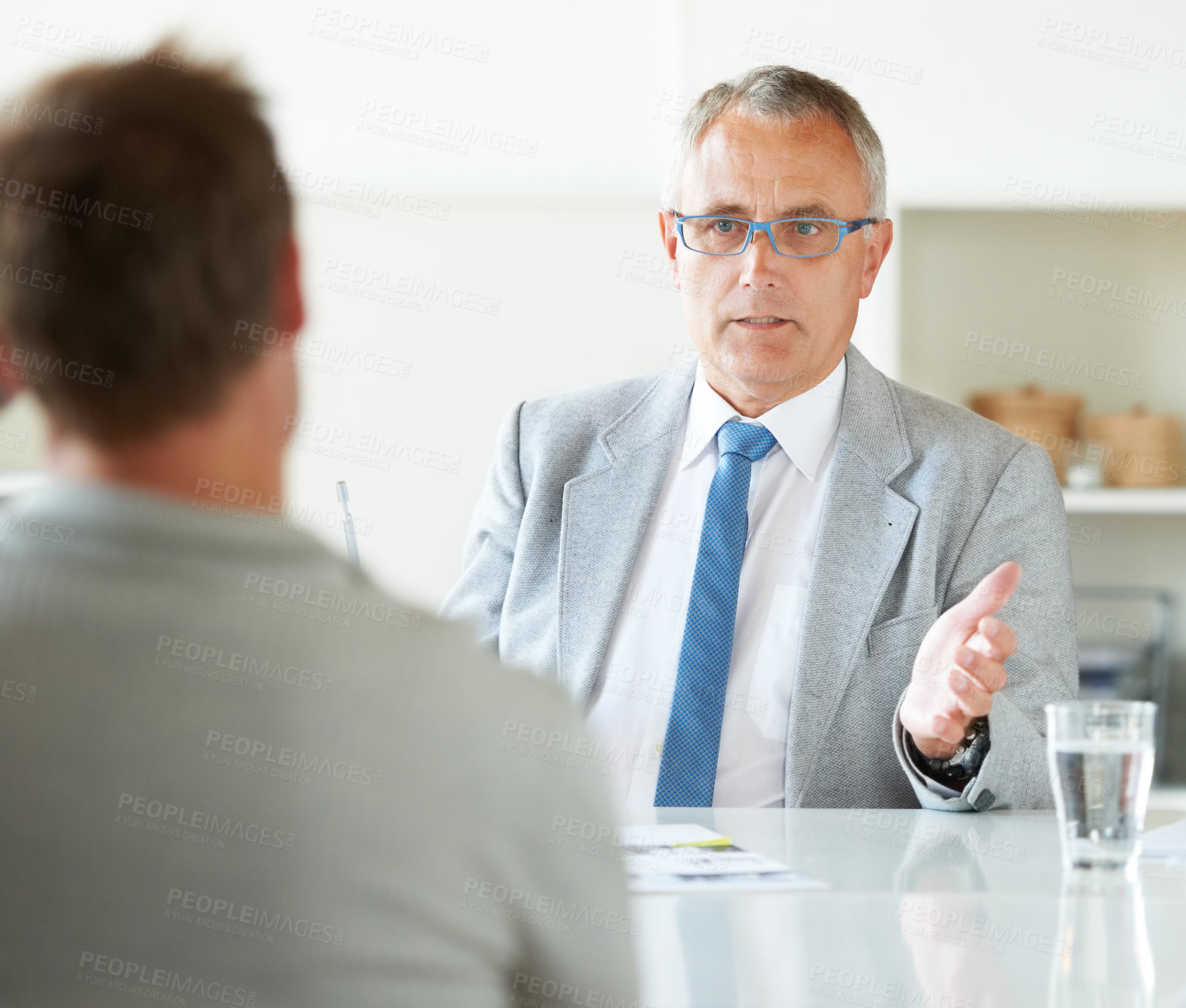 Buy stock photo Meeting, businessman and mature lawyer with advice in office for legal consulting and feedback for client. Attorney, talking and advisor in negotiation debate and professional advocate in law firm