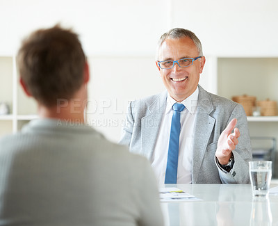 Buy stock photo Meeting, people and happy mature lawyer with advice in office for legal consulting and feedback for client, Businessman, talking and professional attorney in law firm with discussion of contract