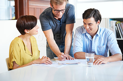 Buy stock photo Business meeting, team and paperwork for planning, research or brainstorming in office with communication. Employees, men and woman with partnership, collaboration or creative and discussion at work