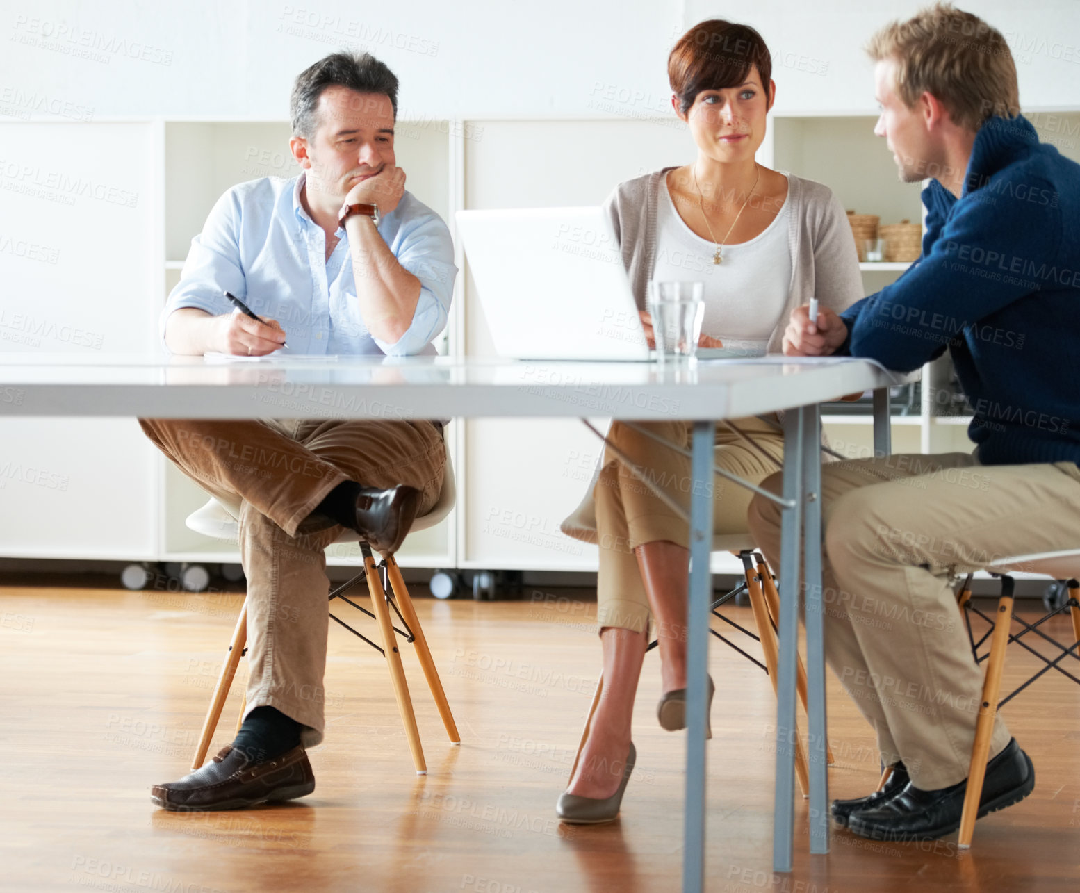 Buy stock photo Man, tired and bored in meeting at office, workplace or people planning with notes and documents. Team, discussion and manager with fatigue, burnout or exhausted at work with staff in conference room