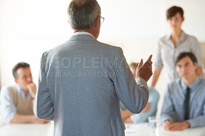 Buy stock photo Man, leader and presentation at conference meeting, workshop and discussion or management in training. Mature businessman, staff and communication in seminar, vision and ideas for future growth