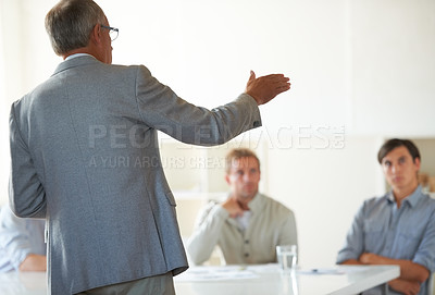 Buy stock photo Man, manager and presentation at conference meeting, workshop and discussion or management in training. Mature businessman, staff and communication in strategy, boss and ideas for future growth
