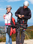 Getting ready for their tandem paragliding