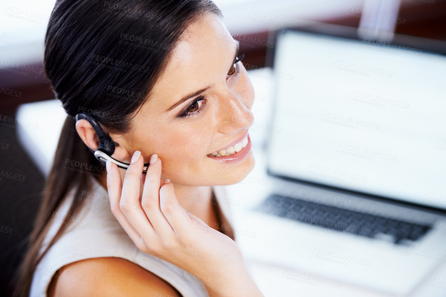 Buy stock photo Shot of a young businesswoman working in an office