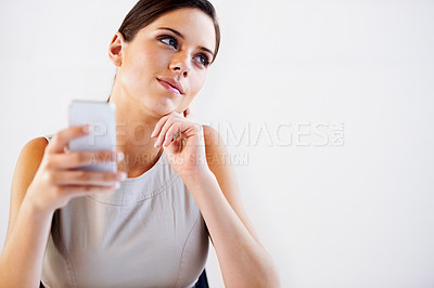 Buy stock photo Face, businesswoman and thinking with phone in office for communication, message or call. Female consultant, alone and idea with vision for social media, app or post by cellular, network or internet