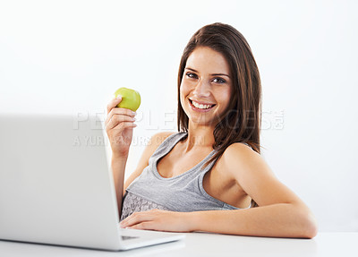 Buy stock photo Laptop, portrait and woman nutritionist with apple in studio for wellness, diet or eating plan on white background. Weight loss, face and female health influencer with blog survey, help or menu guide