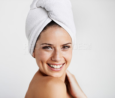 Buy stock photo Smile, skincare and woman with towel in a studio for health, wellness and natural face routine. Happy, beauty and portrait of young female model with facial dermatology treatment by gray background.