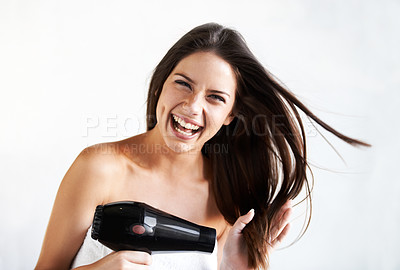 Buy stock photo Woman, smile and blow drying hair with hairdryer, style and heat treatment or blowout, beauty and appliance. Happy female person, haircare and portrait by white background, cosmetic and mockup
