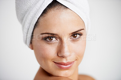 Buy stock photo Skincare, portrait and woman with towel in a studio for health, wellness and natural face routine. Smile, beauty and happy young female model with facial dermatology treatment by gray background.