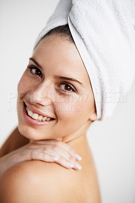 Buy stock photo Health, skincare and woman with towel in studio for cosmetic, wellness and natural face routine. Happy, beauty and portrait of young female model with facial dermatology treatment by gray background.